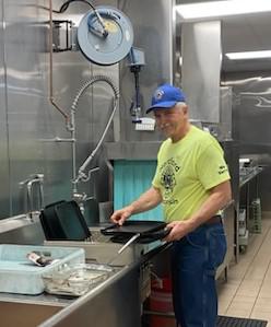 2024 6-5 don cleaning food trays during the hartford lion's pancake breakfast.jpeg