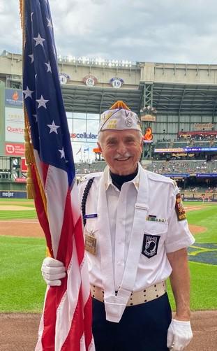 2024 6-11 don holding us flag as part of the brewers pre-game opening flag presentation.jpeg